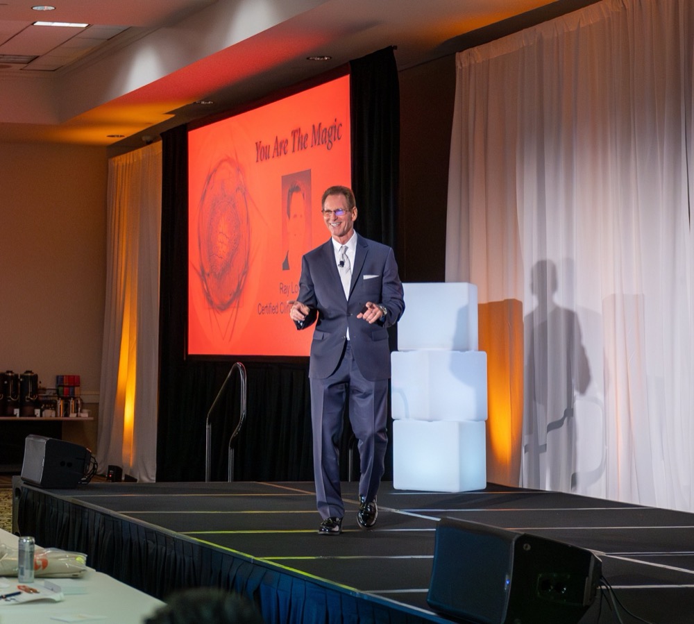 Ray LoCascio presenting on stage at a speaking engagement